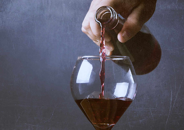 Red wine being poured into a glass